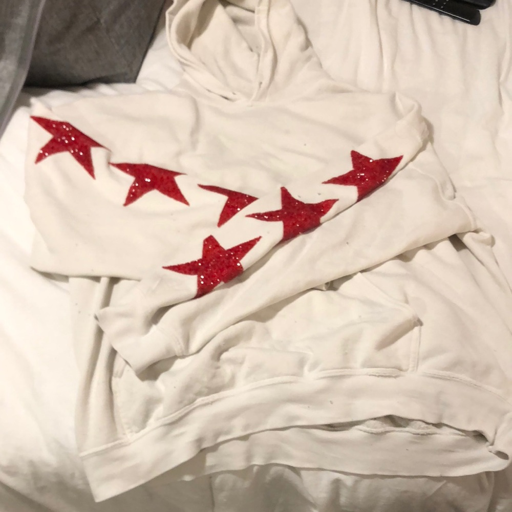 LF distressed hoodie with star rhinestone detail.